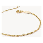 Elegant gold-plated bracelet with spiral filigree design and adjustable length, perfect for personalized style.