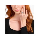 Elegantly showcasing the Bague collège ring, a silver craftsmanship piece with a stunning design and personal talisman.