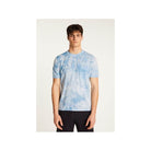 Model wearing a light blue T-Shirt Marquez with a modern fit and elegant style, perfect for sunny days.