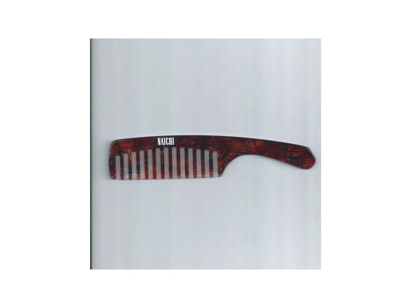 Peigne Wet Comb en acétate de cellulose, dents larges pour démêlage doux et éco-responsable.