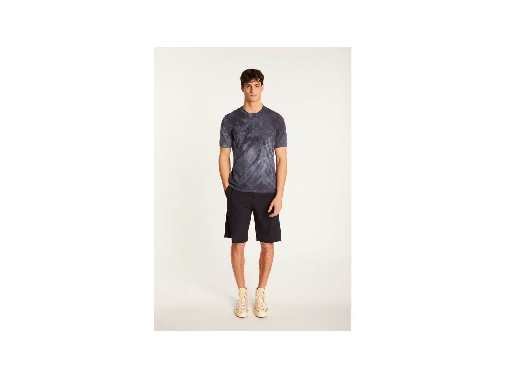 Model wearing T-Shirt Marquez in navy, paired with shorts for a casual summer look.