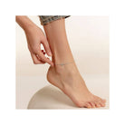 Ankle chain with heart charm, showcasing a chic bohemian style, perfect for summer outfits and adjustable fit.