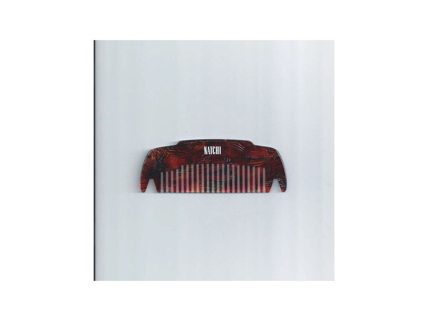 Peigne Coco en acétate de cellulose, conçu pour démêler et masser le cuir chevelu, favorisant la santé capillaire.