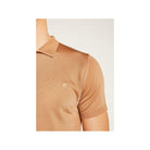 Close-up of a tan short-sleeve polo shirt made of Fil lumière fabric, showcasing its elegant texture.
