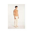 Polo fil lumière Babar beige, homme, avec manches courtes, porté avec un pantalon clair, élégant et confortable.