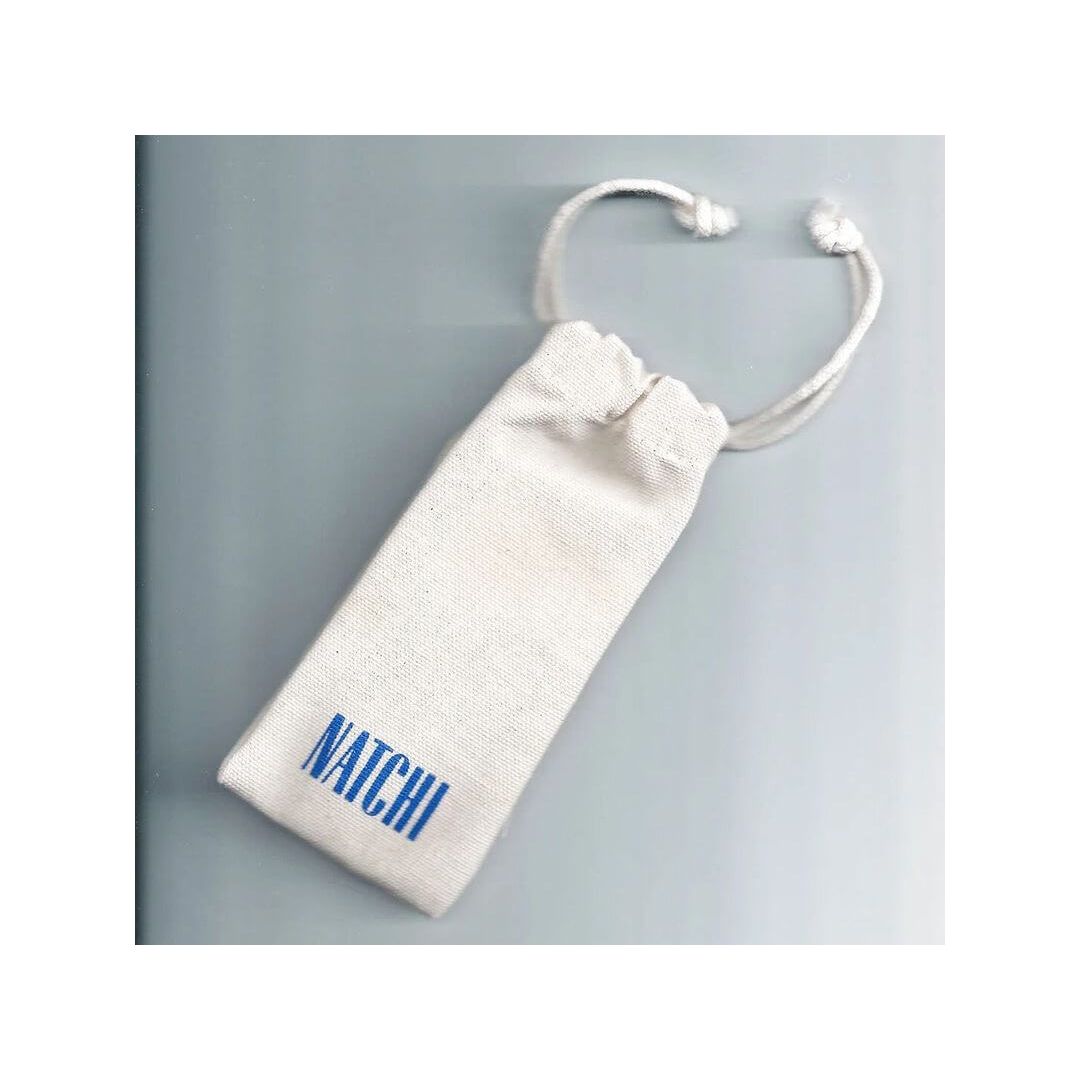 Natchi branded drawstring bag made of natural fabric, ideal for eco-friendly storage and travel.