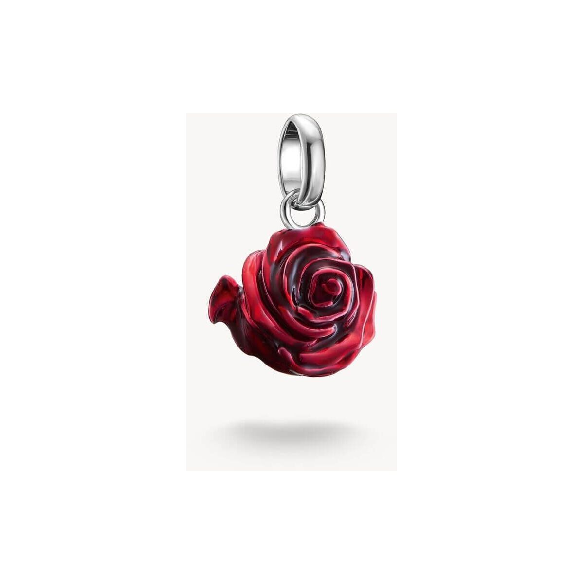 Charm pendant in recycled silver featuring a 3D red rose, detailed with hand-applied red enamel.