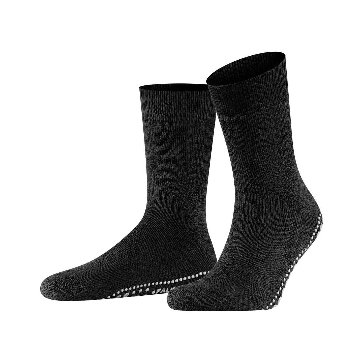 Chaussettes Homepads FALKE noires avec semelle en silicone pour une adhérence sécurisée à la maison.