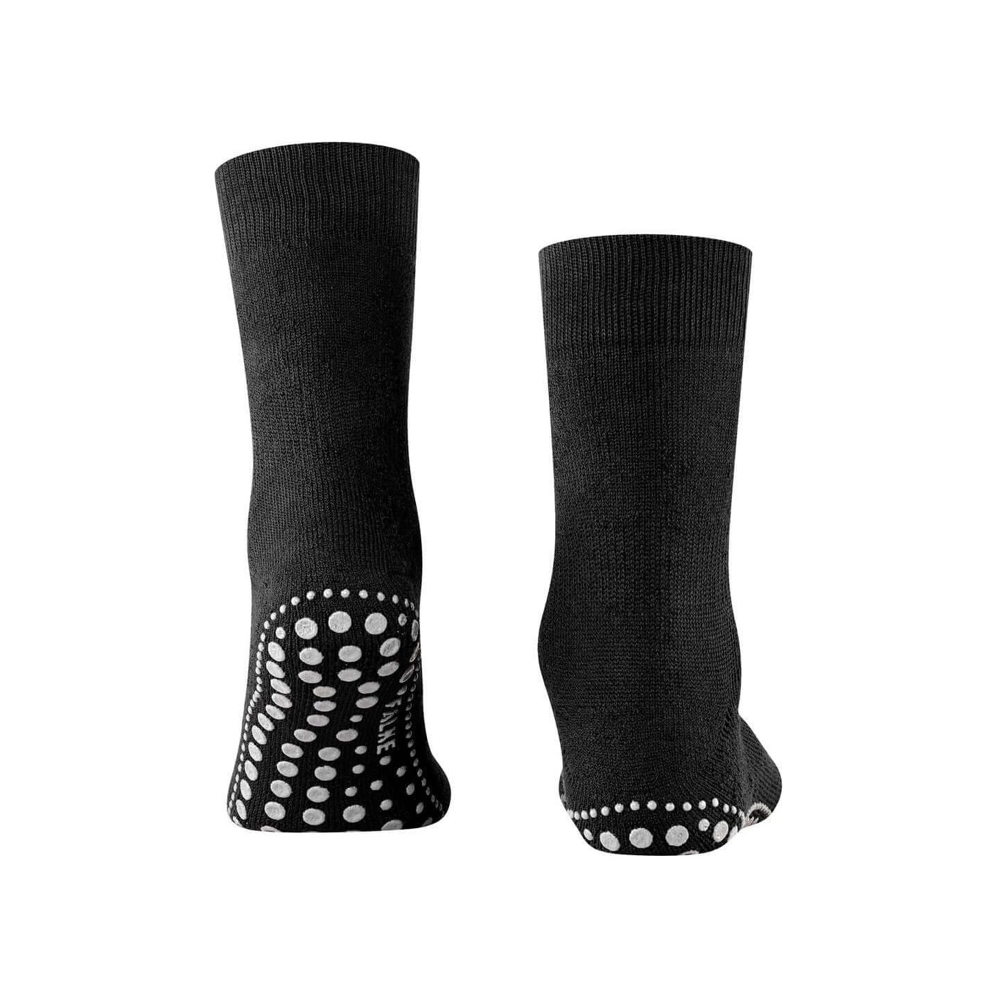 Chaussettes Homepads en noir avec picots en silicone pour une adhérence optimale à la maison.