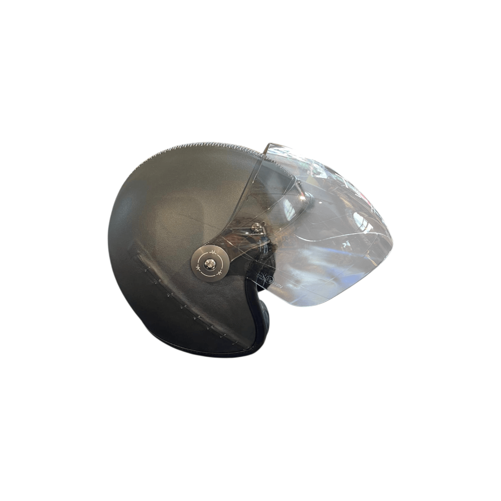Casque de moto noir avec visière transparente, design élégant, sécurité et confort pour les motards.