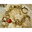 Bracelet Créazione with gold links and Mediterranean red coral, showcasing superior craftsmanship and unique design.